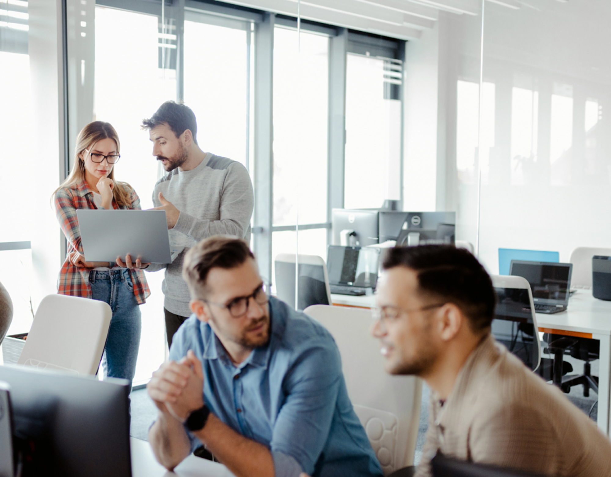 Business team collaborating on mobile BI development with IT outsourcing partner.